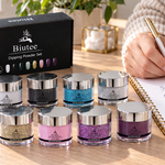 Adult reviewing supplies beside eight silver-lidded BIUTEE dip powder jars at a manicure desk