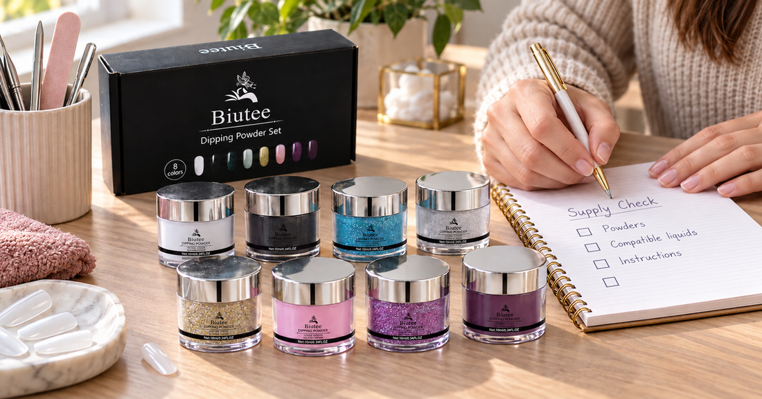 Adult reviewing supplies beside eight silver-lidded BIUTEE dip powder jars at a manicure desk